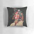 Surreal portrait pillow with man's face surrounded by blooming red roses in a vintage botanical collage style