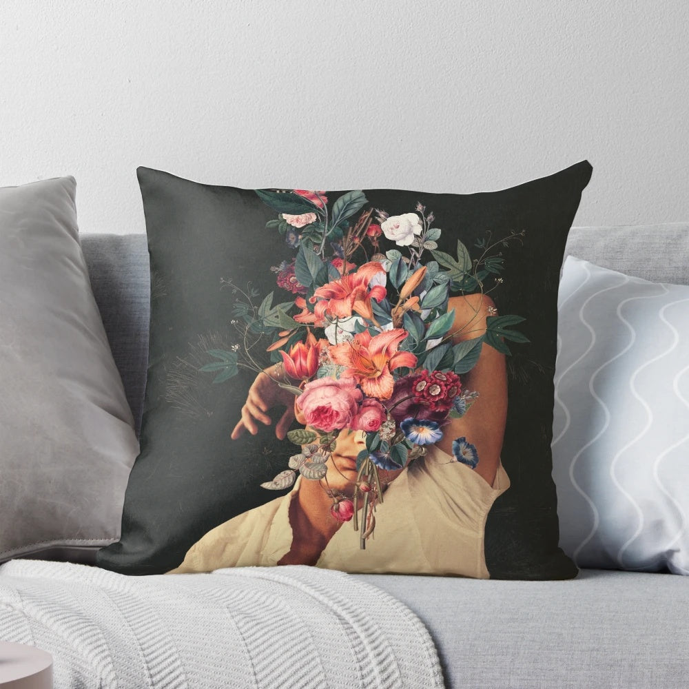 Surreal portrait pillow with man's face surrounded by blooming red roses in a vintage botanical collage style