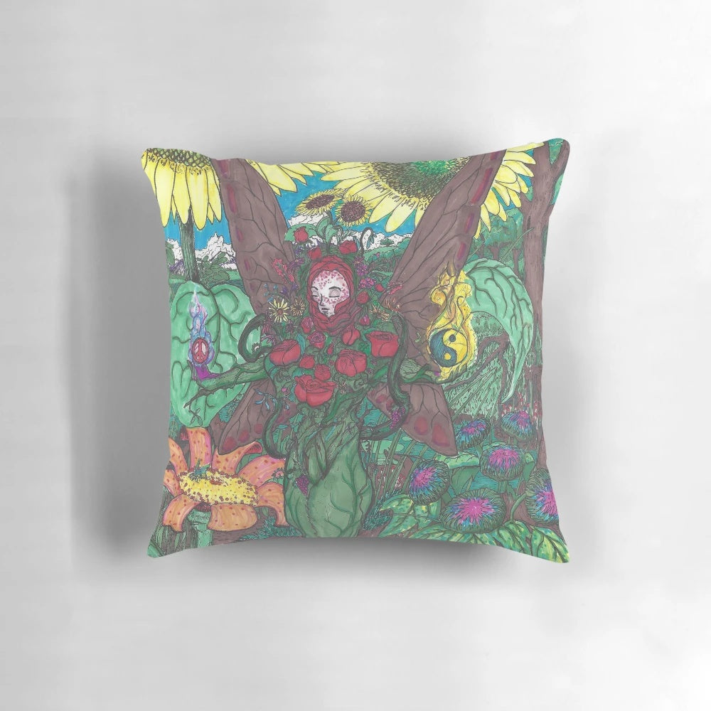 Colorful, abstract image of a lady's face surrounded by whimsical plant life on a decorative throw pillow.