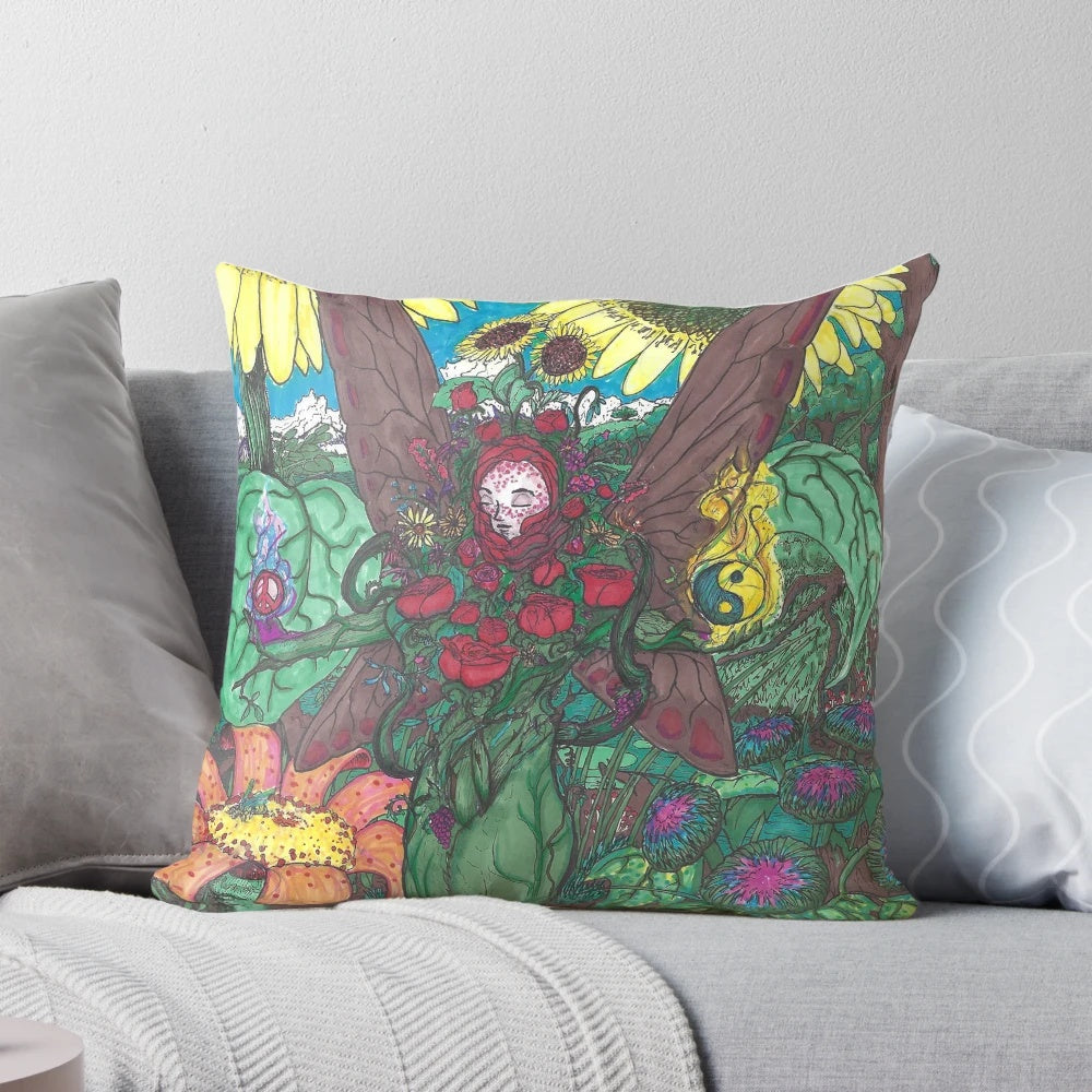 Colorful, abstract image of a lady's face surrounded by whimsical plant life on a decorative throw pillow.