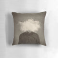 Surreal, abstract pillow featuring a headless figure in a foggy, smoke-filled environment