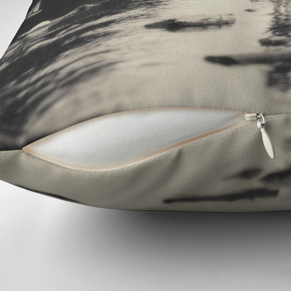 Surreal pillow featuring a dreamscape with a boy, moon, clouds, and water on a dark background