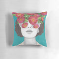 Pillow with a surreal watercolor portrait of a woman wearing rose-tinted glasses and surrounded by flowers