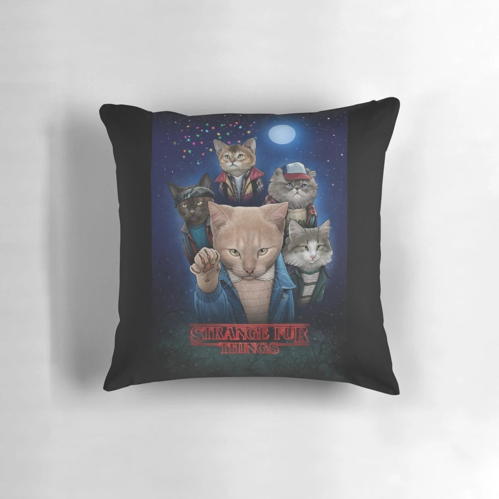 Whimsical pillow featuring upside down cats and kittens in a strange, surreal design.