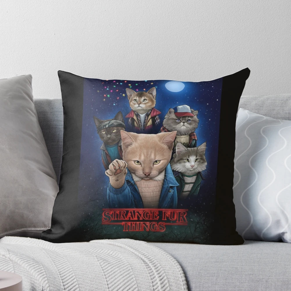 Whimsical pillow featuring upside down cats and kittens in a strange, surreal design.