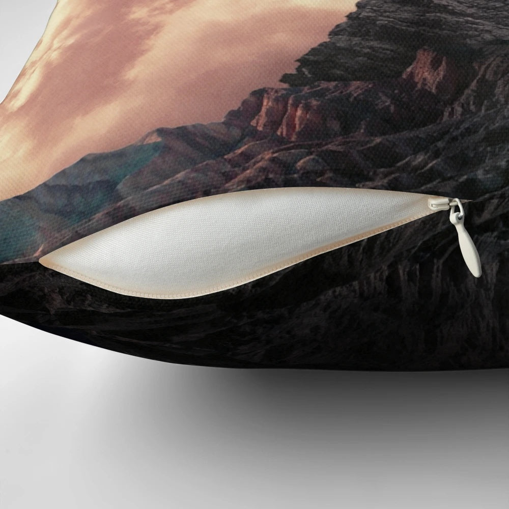 Surreal vintage-style pillow with a collage design of a woman in a landscape with mountains and clouds.