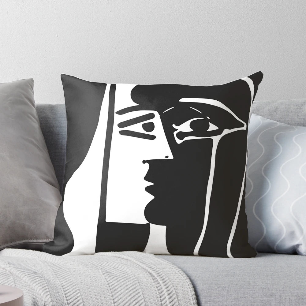Surrealist black and white throw pillow featuring abstract art inspired by the visionary paintings of Spanish artist Joan Miro.