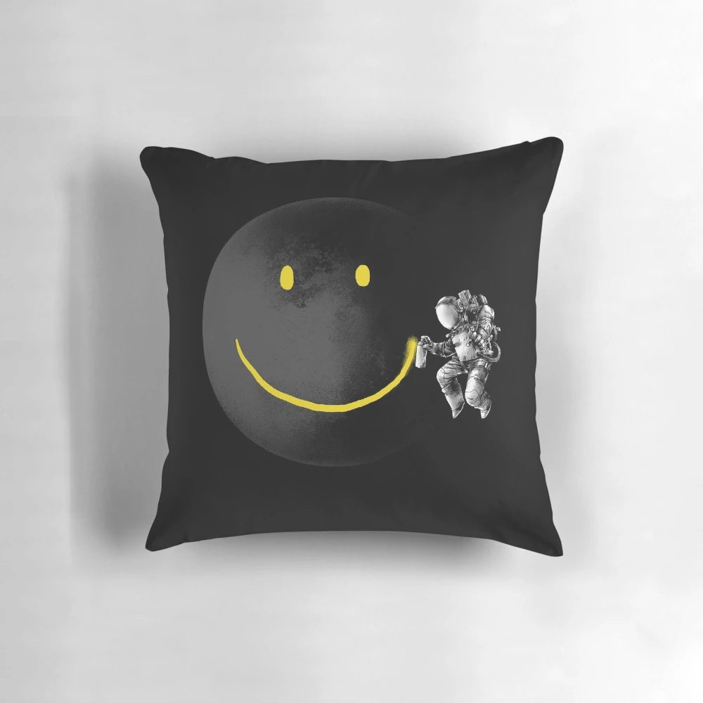 Surrealist black and white pillow with a smiling face design, perfect for sci-fi and astronomy enthusiasts.