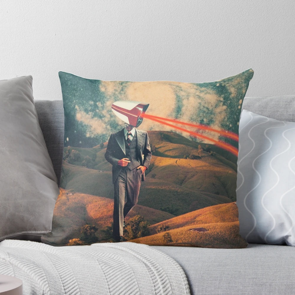 A surrealist digital art pillow featuring a collage of a camera and a dystopian sky landscape with the text "We Are Watching You for Your Own Safety
