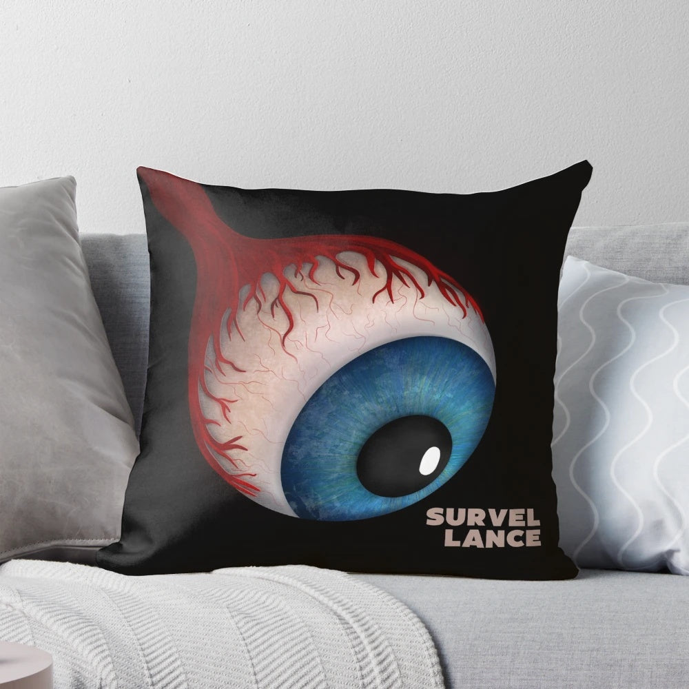 A decorative throw pillow with a bold graphic design featuring a surveillance camera or eye, suitable for modern or sci-fi inspired home decor.