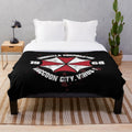 Plush blanket with Umbrella Corporation logo from horror video game