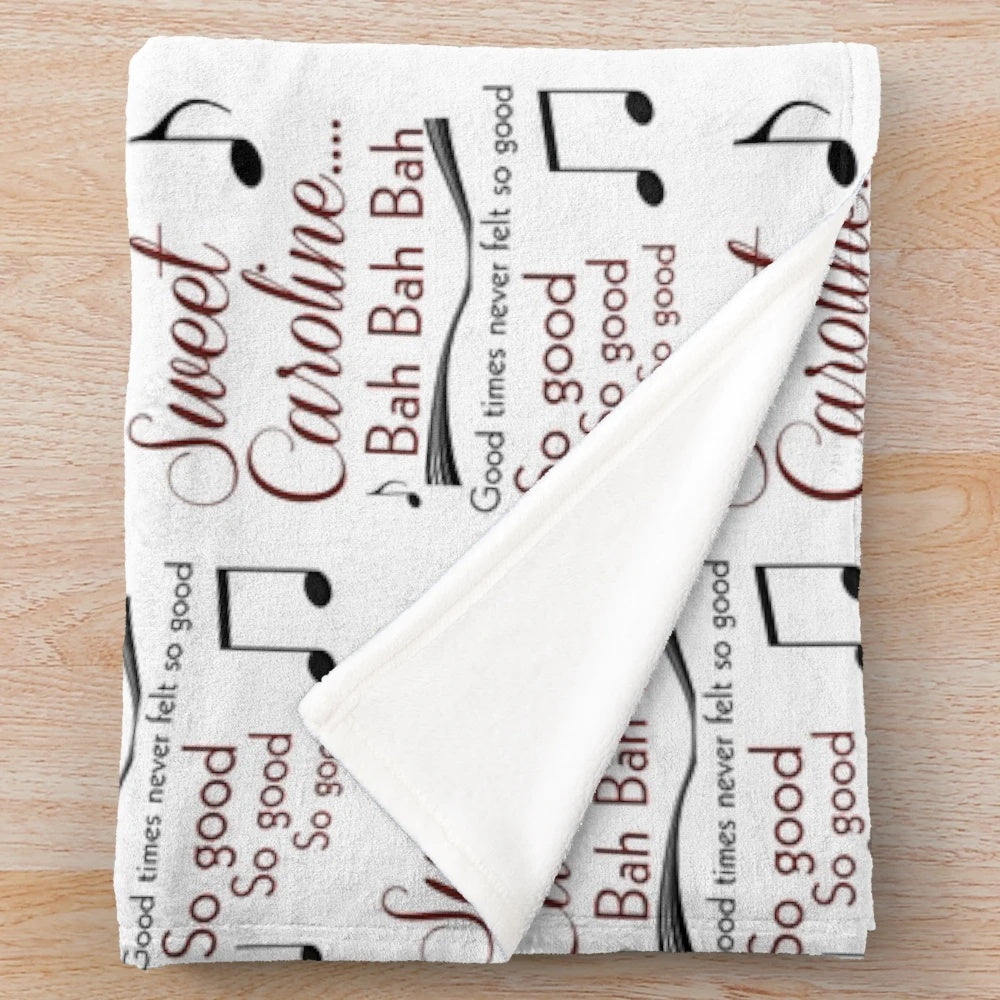 Sweet Caroline inspired plush blanket featuring musical notes and lyrics
