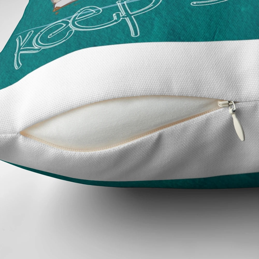 A blue and white pillow with a swimming fish design, perfect for ocean themed home decor.