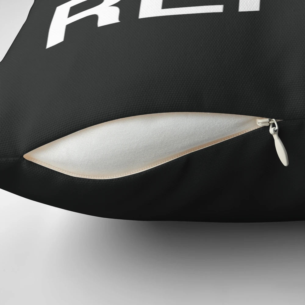 A white pillow with the text "Eat Sleep Swim Repeat" and a swimmer graphic