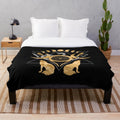 Plush blanket featuring the symbols of the Greek goddess Hecate, including the wheel, torches, and triple moon.