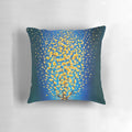 Vibrant blue and orange pillow with flowing, symmetrical leaf design
