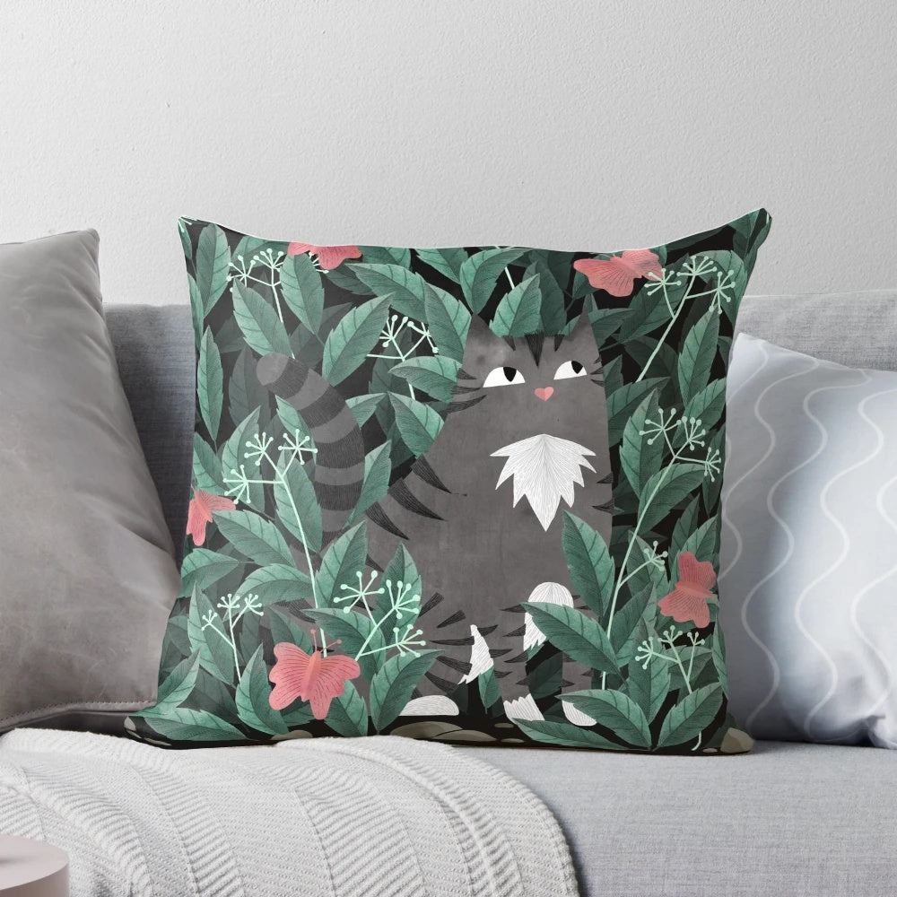 Tabby cat pillow with a lush, jungle-inspired butterfly garden design