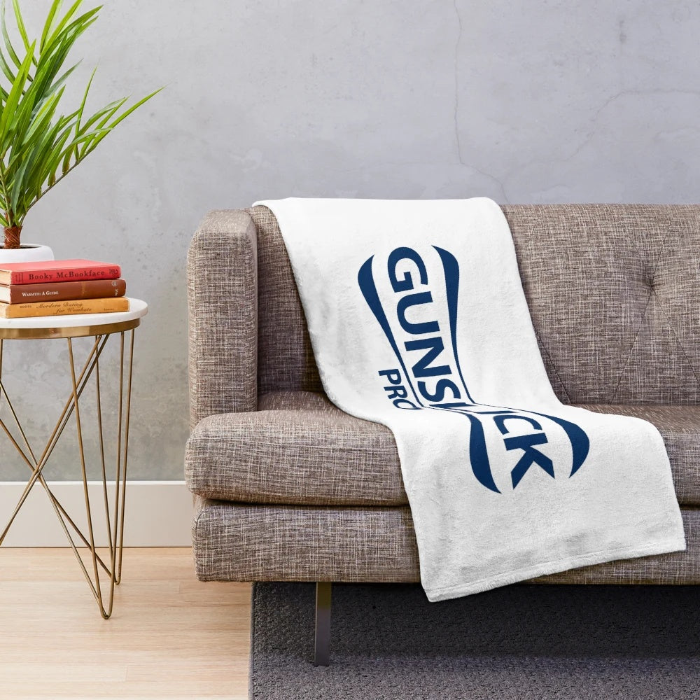 Tactical-styled plush blanket for gun enthusiasts and outdoor activities