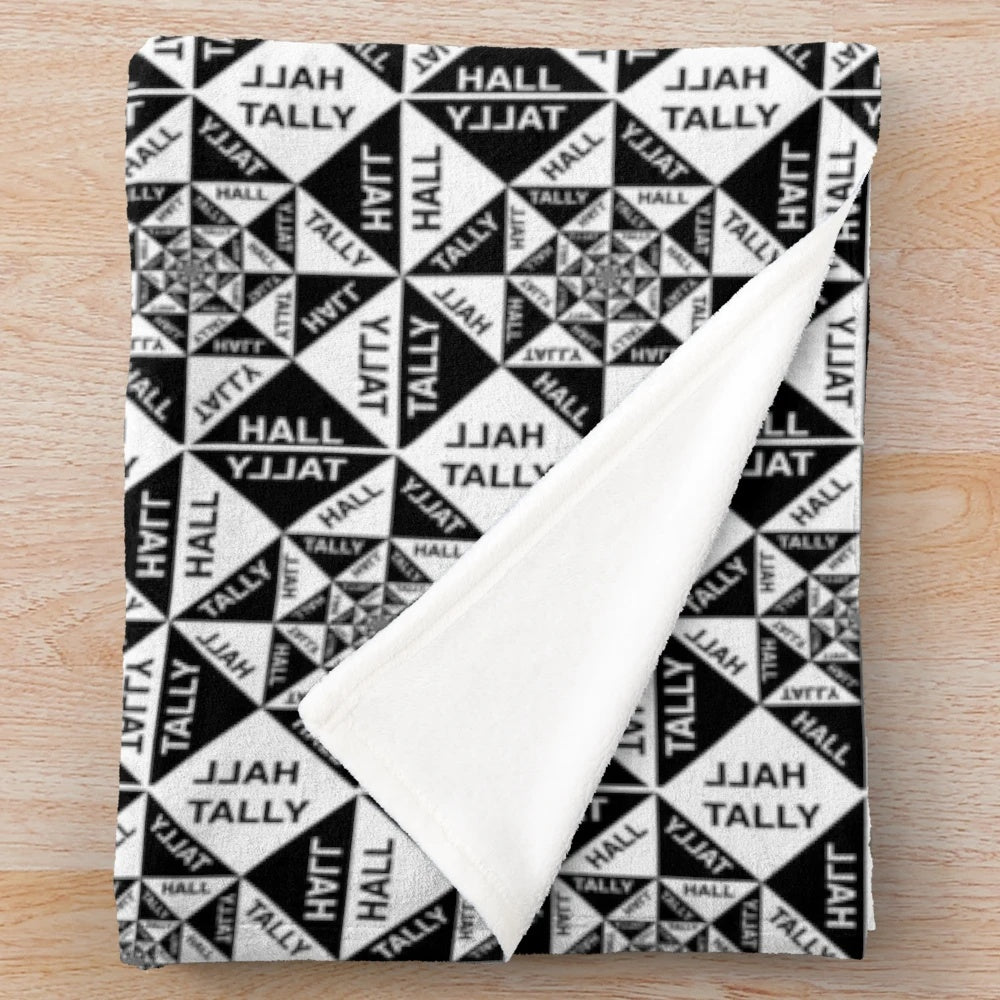 Tally Hall plush blanket with band logo and tropical imagery