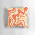 Tangerine-colored abstract swirl pattern on a modern throw pillow