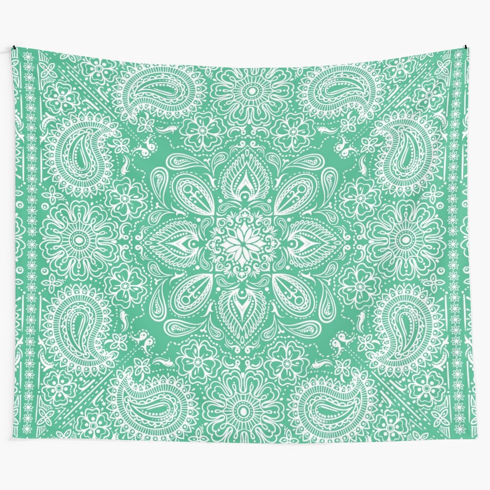 Mint and white tapestry with a paisley and mandala pattern featuring symmetrical flowers