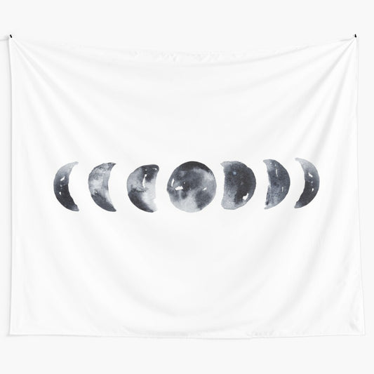 Watercolor painting of the phases of the moon on a tapestry wall hanging