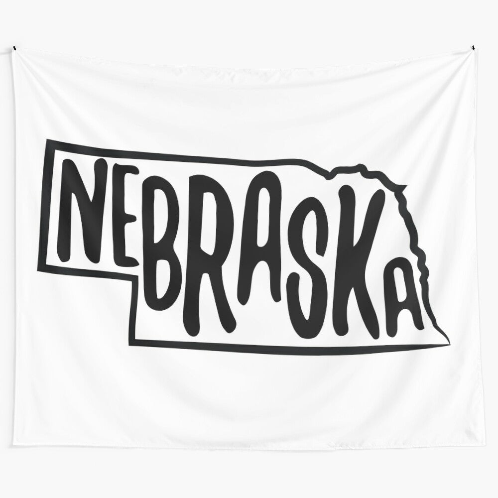 Monochrome artwork featuring the outline of the state of Nebraska