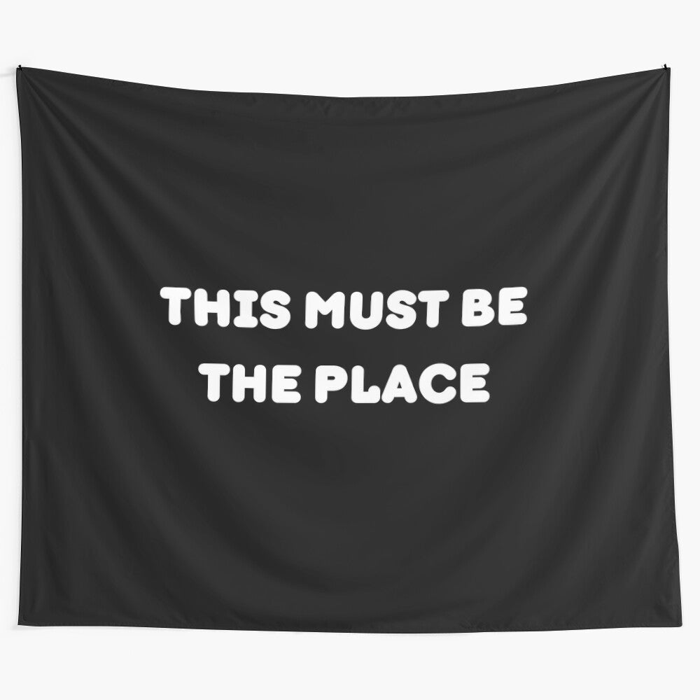 Tapestry with the phrase "This Must Be The Place" in a modern, minimalist design