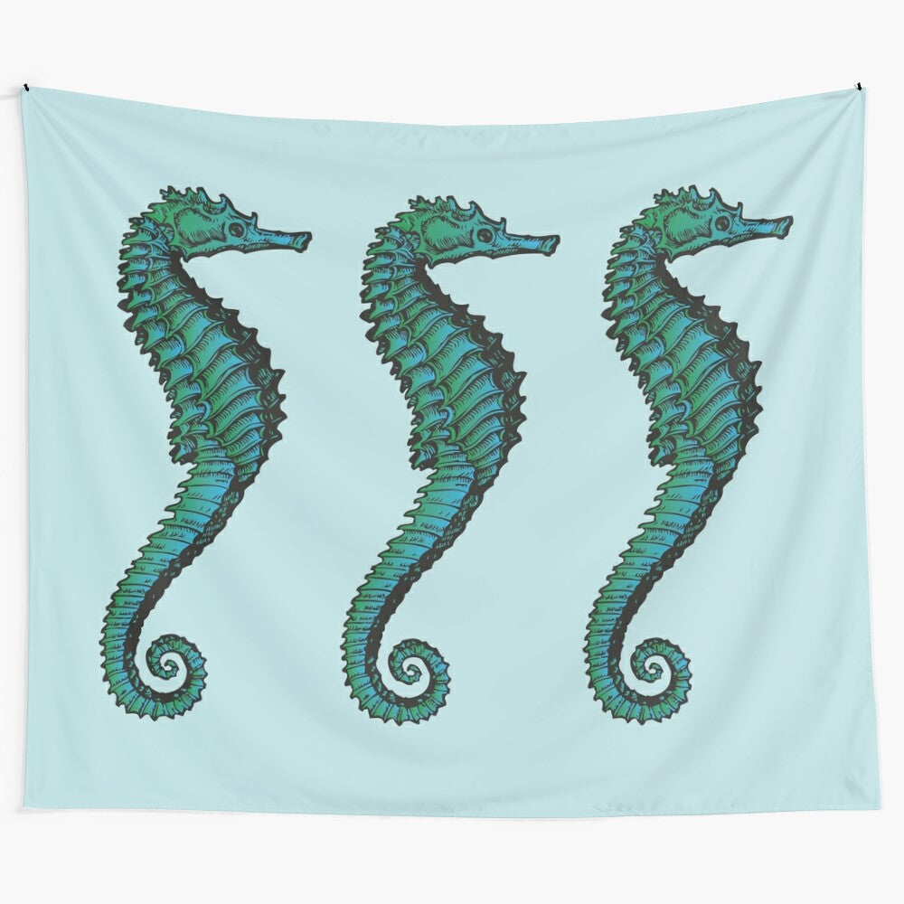 Vintage-inspired tapestry featuring a trio of blue and green seahorses