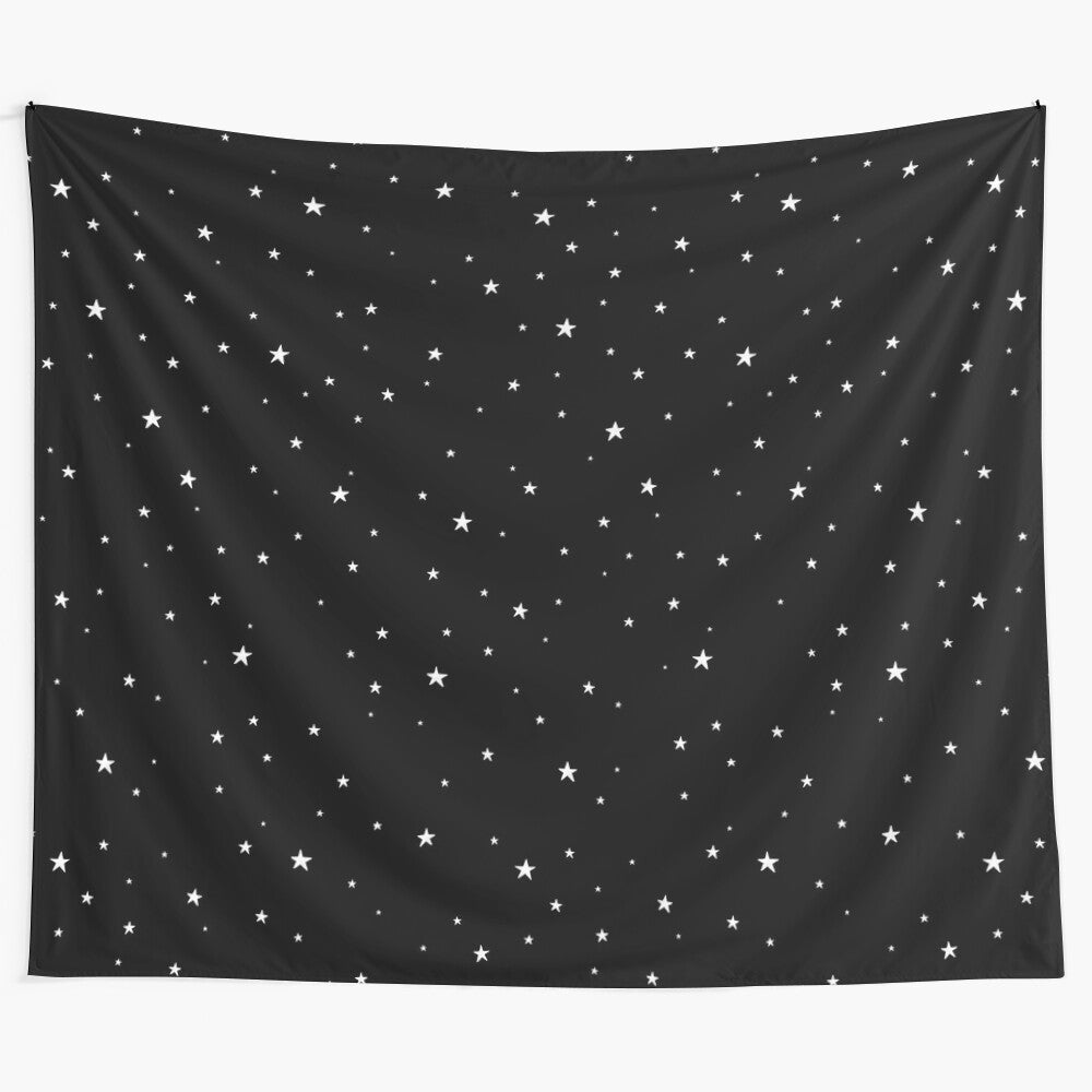 Minimalist black and white tapestry with a pattern of tiny, hand-drawn stars