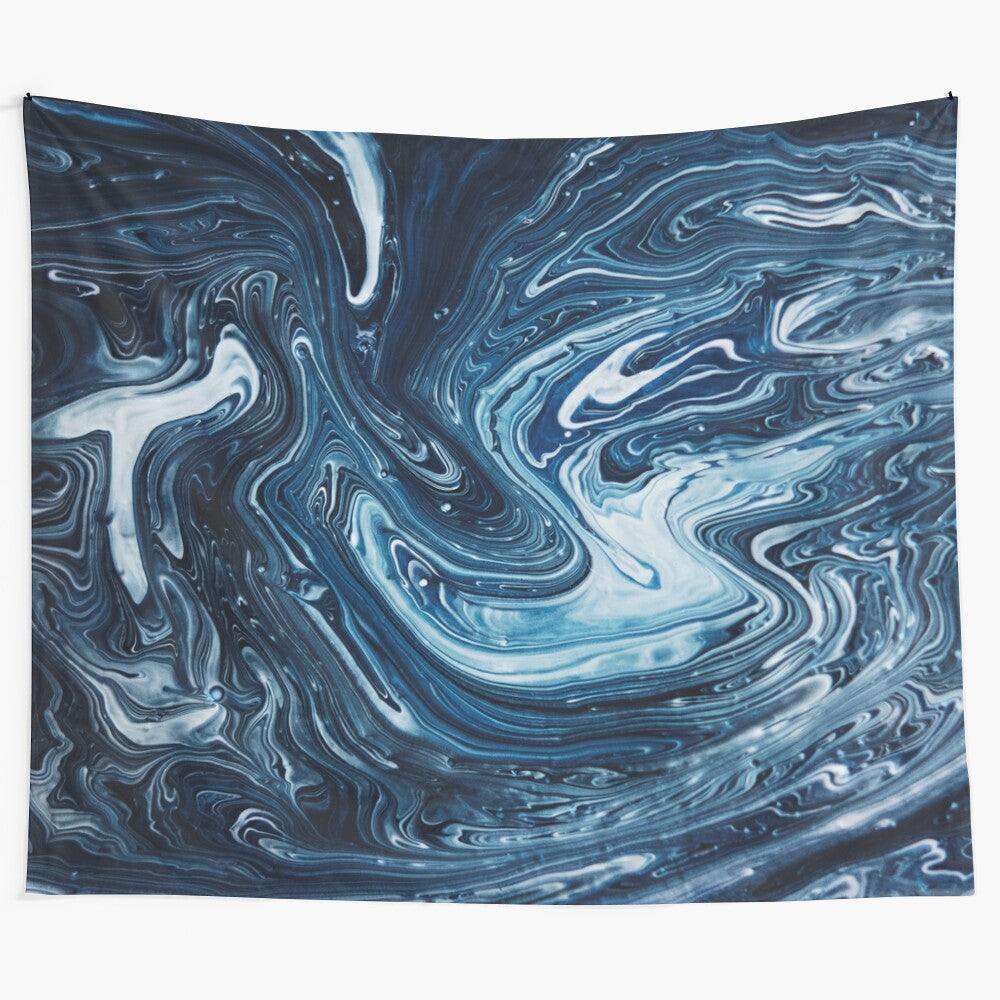 Gravity III Tapestry featuring abstract swirling marble-like patterns in blue, white, and dark colors