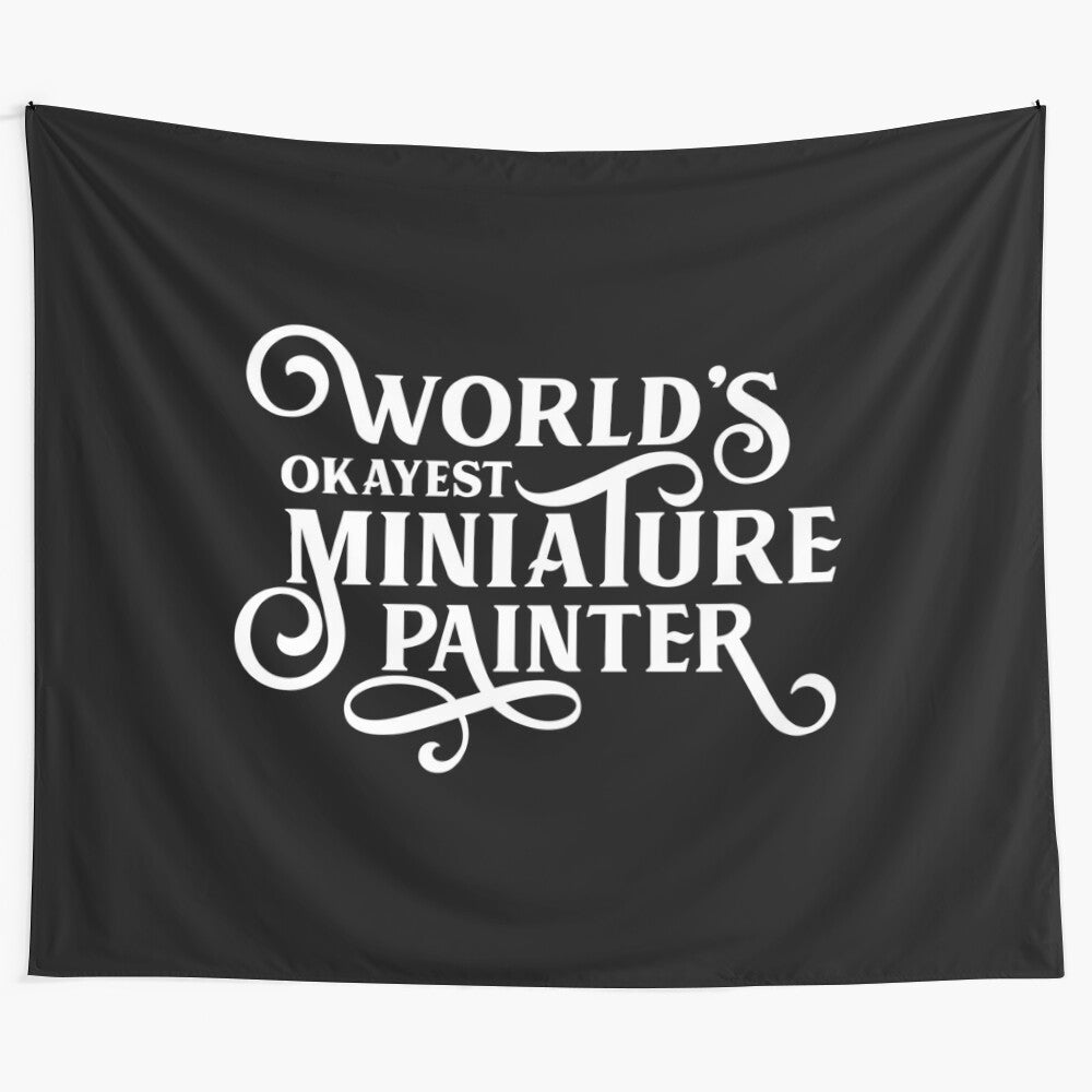 Tapestry featuring a humorous design for the "World's Okayest Miniature Painter" for tabletop gaming and fantasy art enthusiasts.