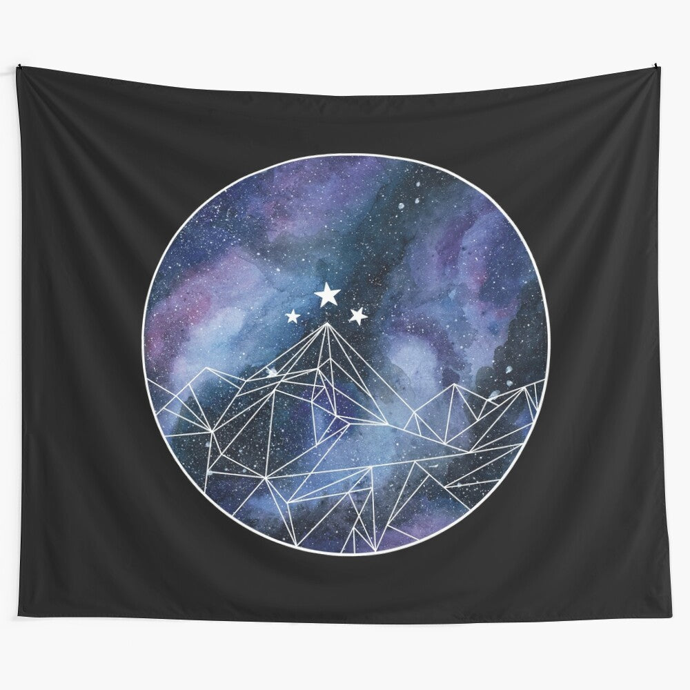 Tapestry featuring a night court symbol design with a watercolor galaxy background and mountains in the distance