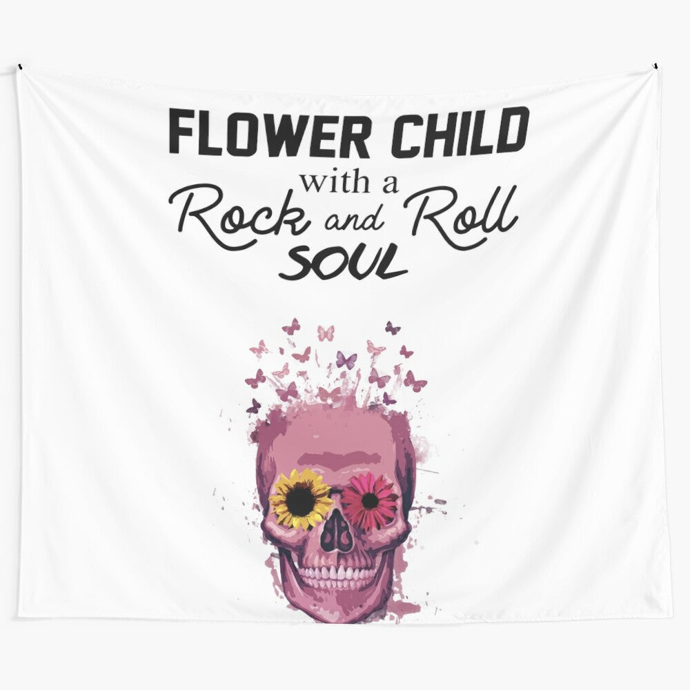 Colorful rock and roll themed tapestry with flowers, skulls, and butterflies