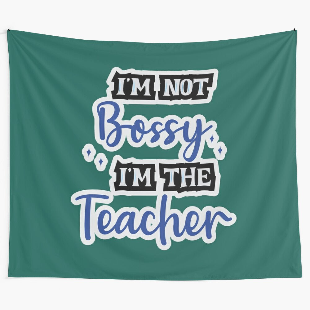 "I'm Not Bossy, I'm the Teacher" inspirational tapestry design featuring a chalkboard and teacher's supplies