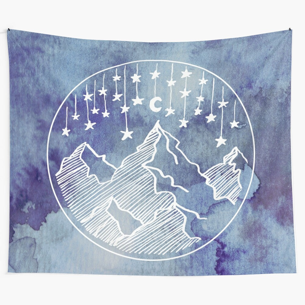 Watercolor tapestry featuring a galaxy scene with mountains and stars