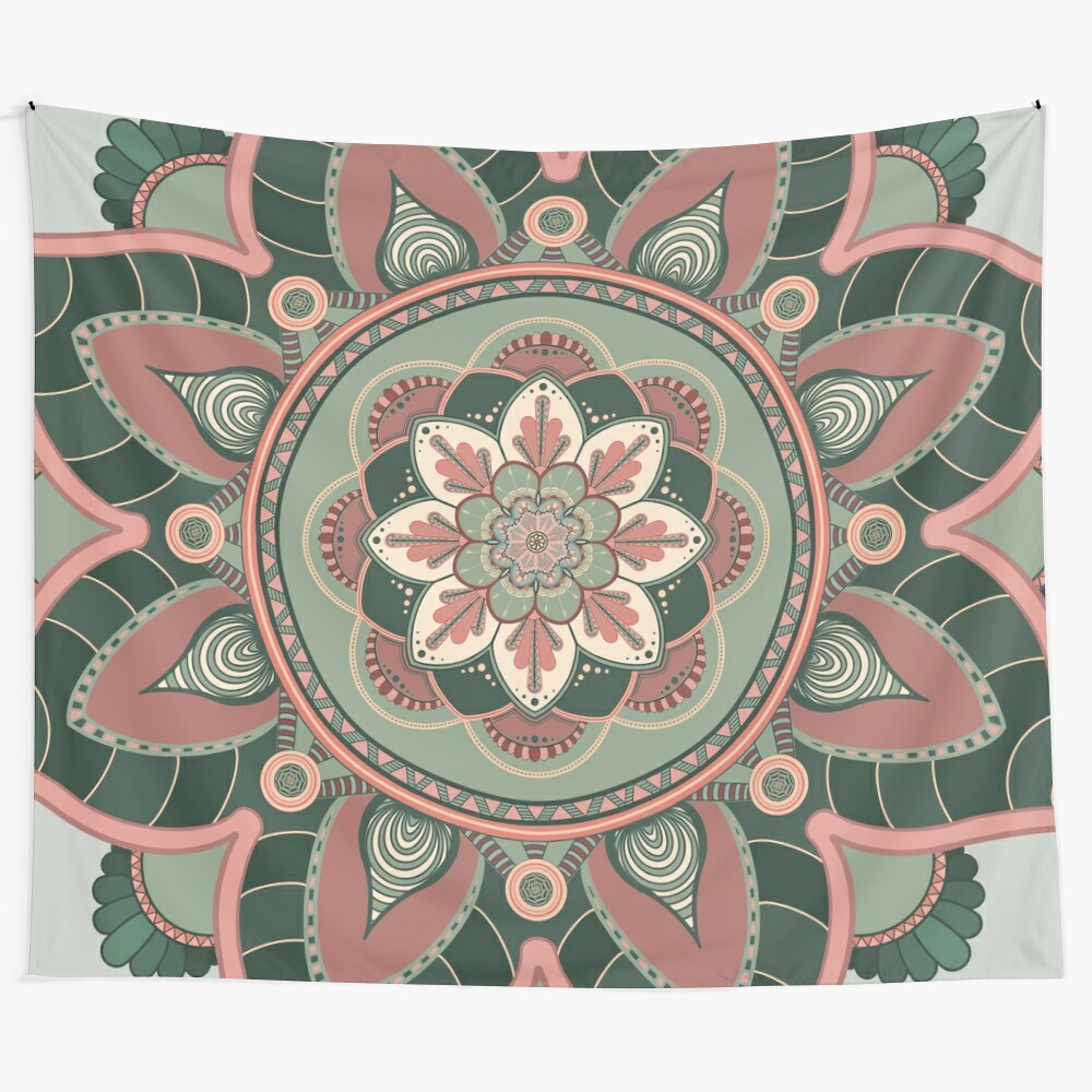 Handcrafted mandala tapestry in shades of green, pink, and earth tones