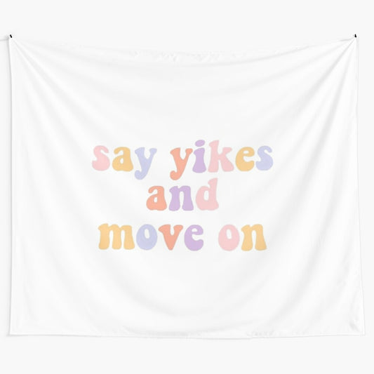 "Say Yikes and Move On" motivational tapestry with pink, yellow, and purple colors