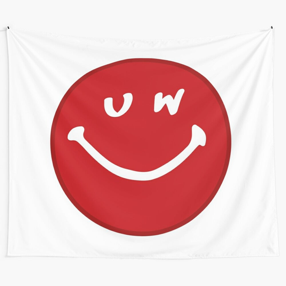 Colorful UW smiley face tapestry depicting Wisconsin college pride