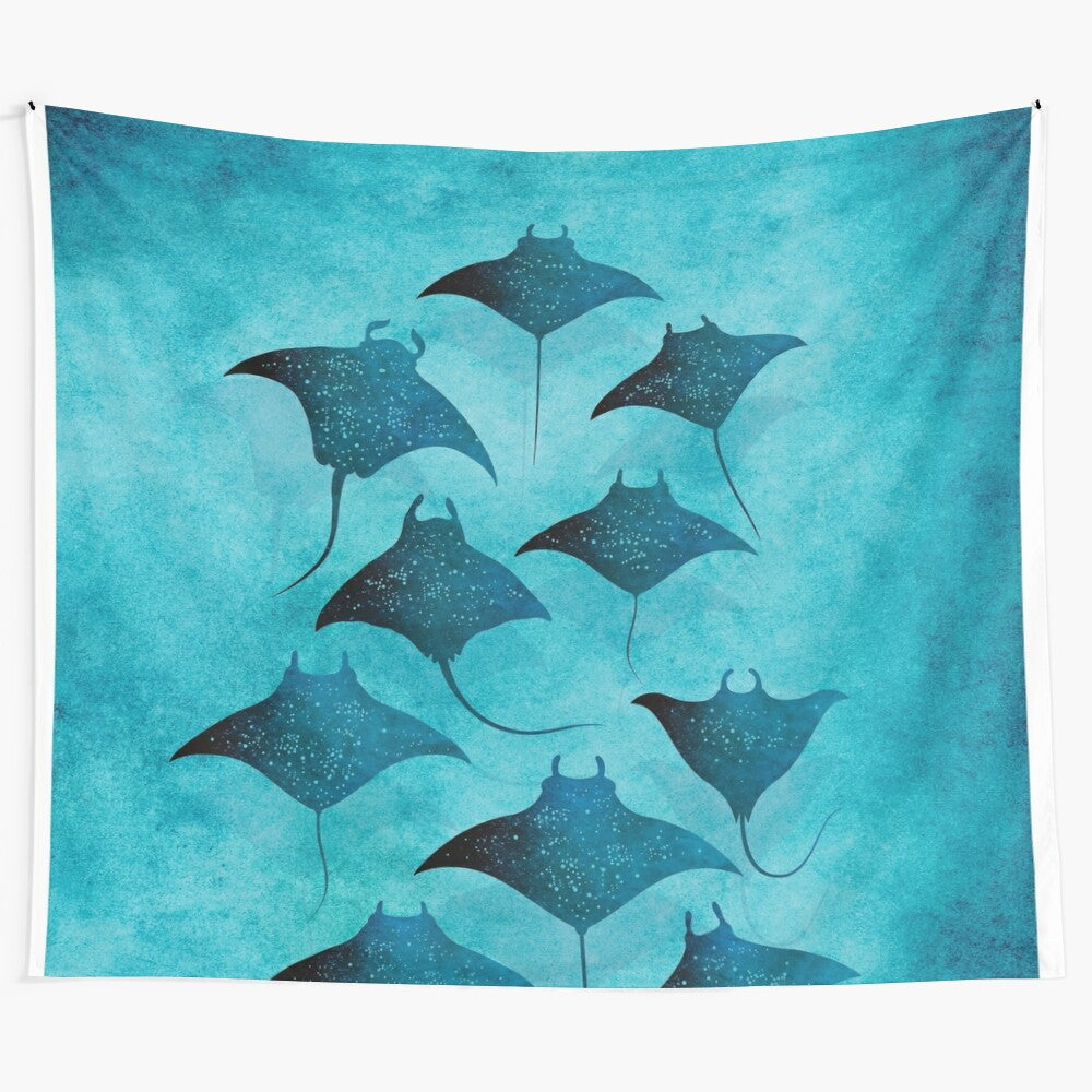 Manta ray art tapestry featuring a group of spotted eagle rays swimming in the deep blue ocean