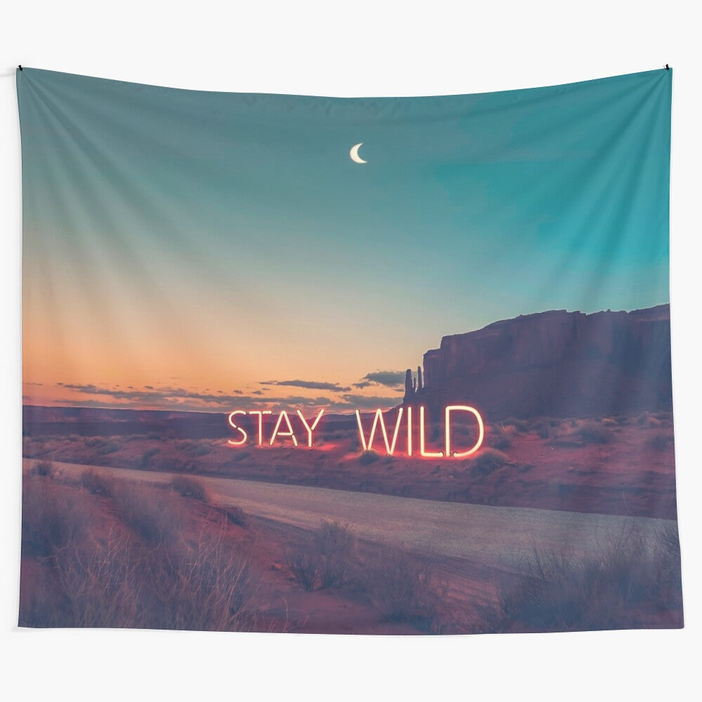 Stunning "Stay Wild" tapestry artwork featuring a desert landscape at sunset with neon text