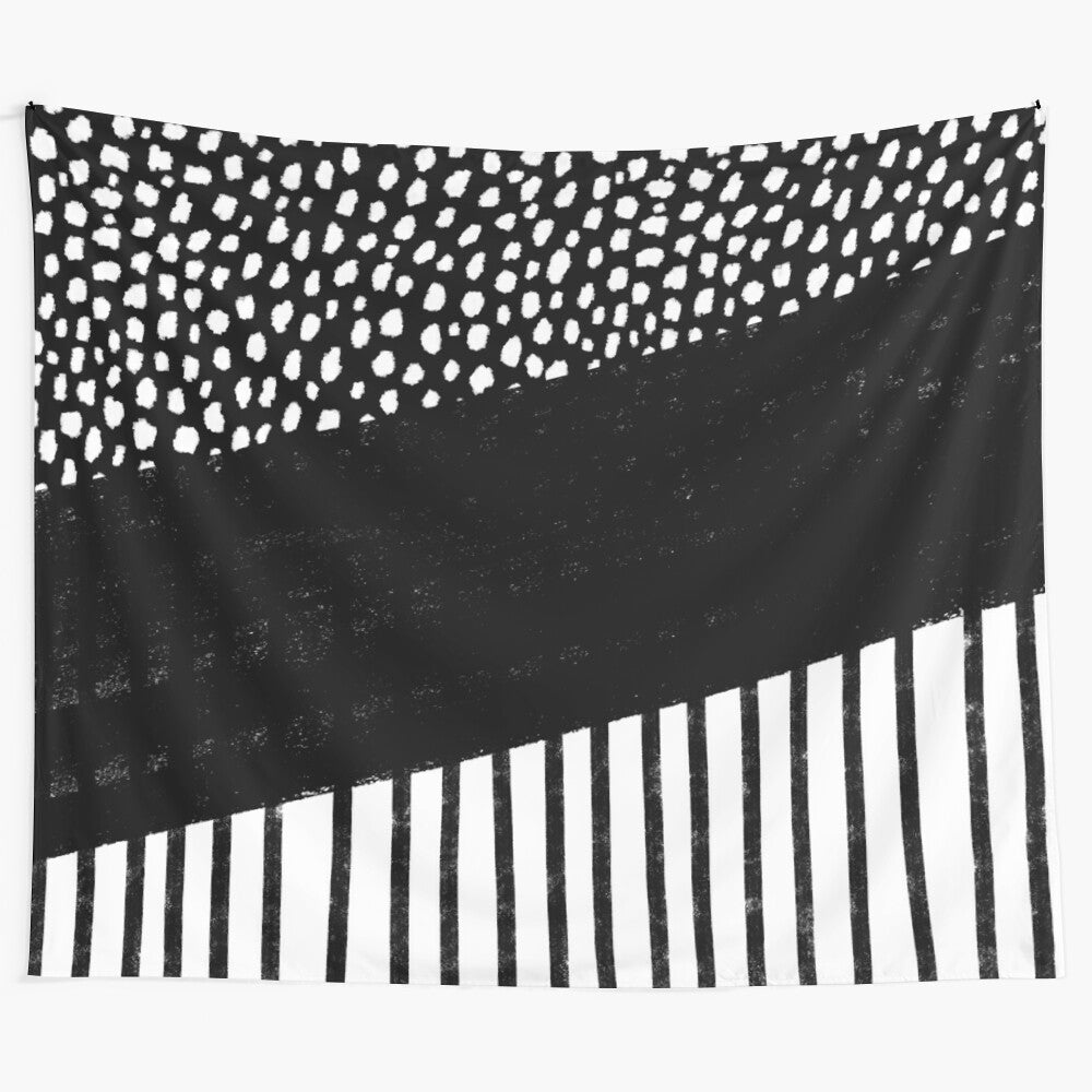 Black and white tapestry with polka dot and stripe pattern