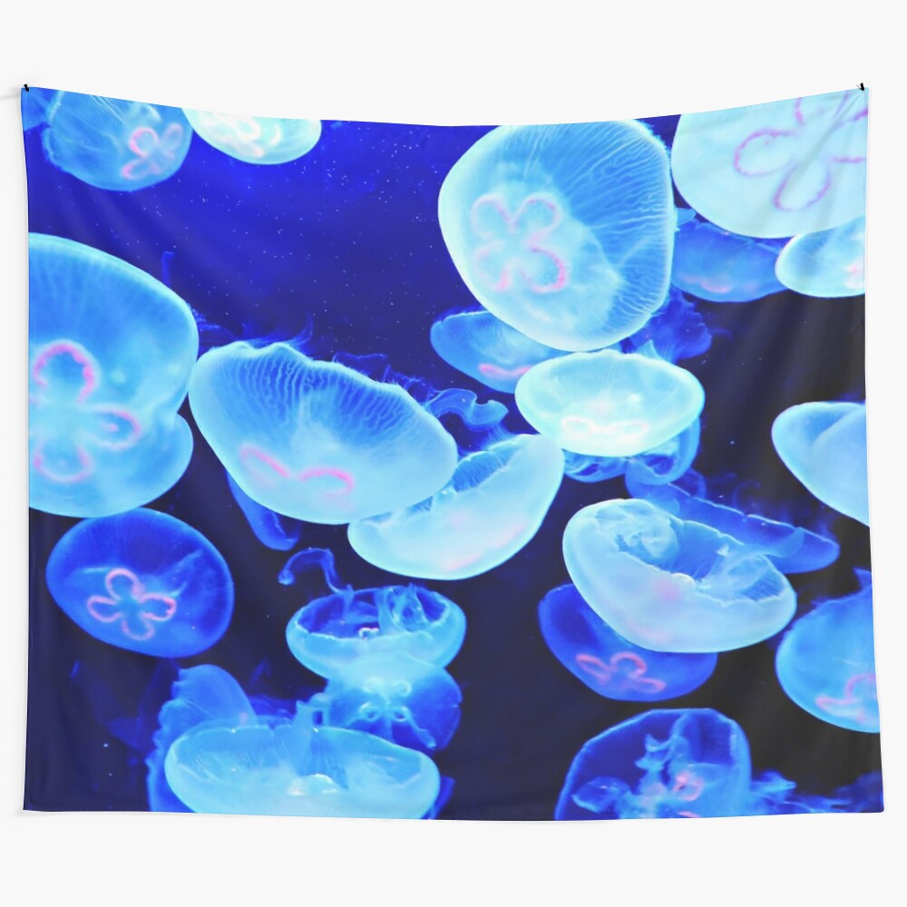 Beautiful blue jellyfish tapestry hanging on wall