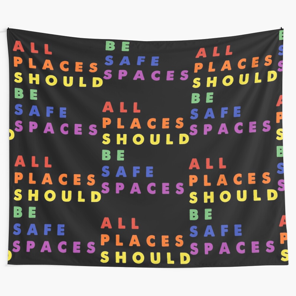 Colorful LGBTQIA+ pride tapestry with the text "All Places Should Be Safe Spaces"