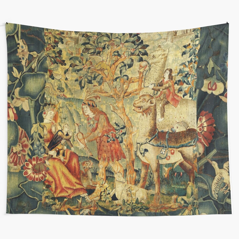 Antique floral tapestry featuring wild men, fantastic animals, and birds in a lush landscape