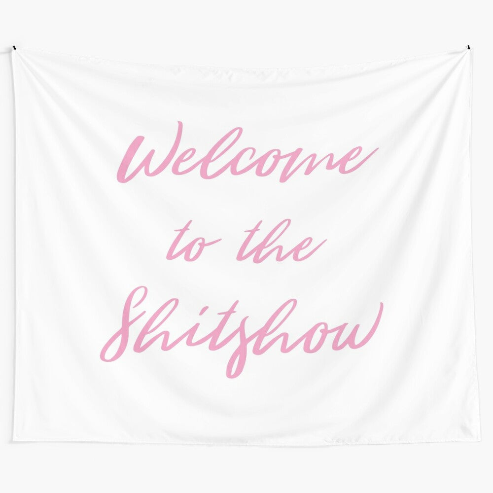 Colorful tapestry with the text "Welcome to the Shitshow" in cursive font