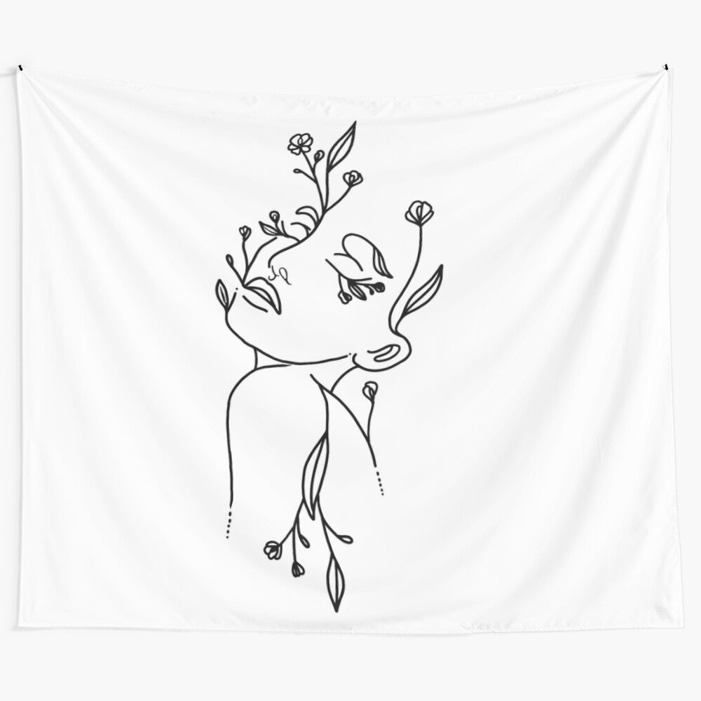 Minimalist line art tapestry featuring a woman's silhouette with flowers