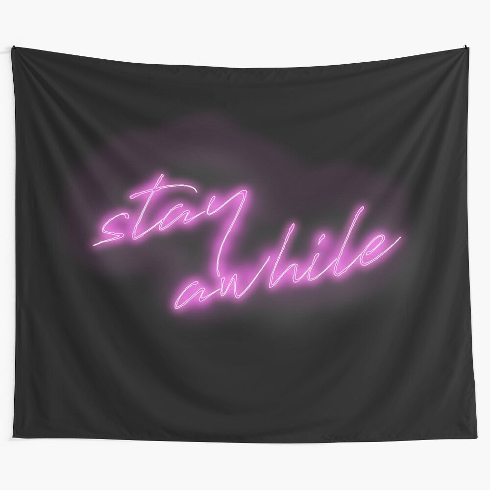 Colorful neon sign tapestry with text "Stay Awhile"