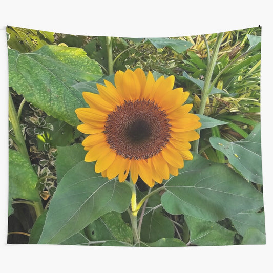 Sunflower tapestry with a vibrant yellow flower and green leaves