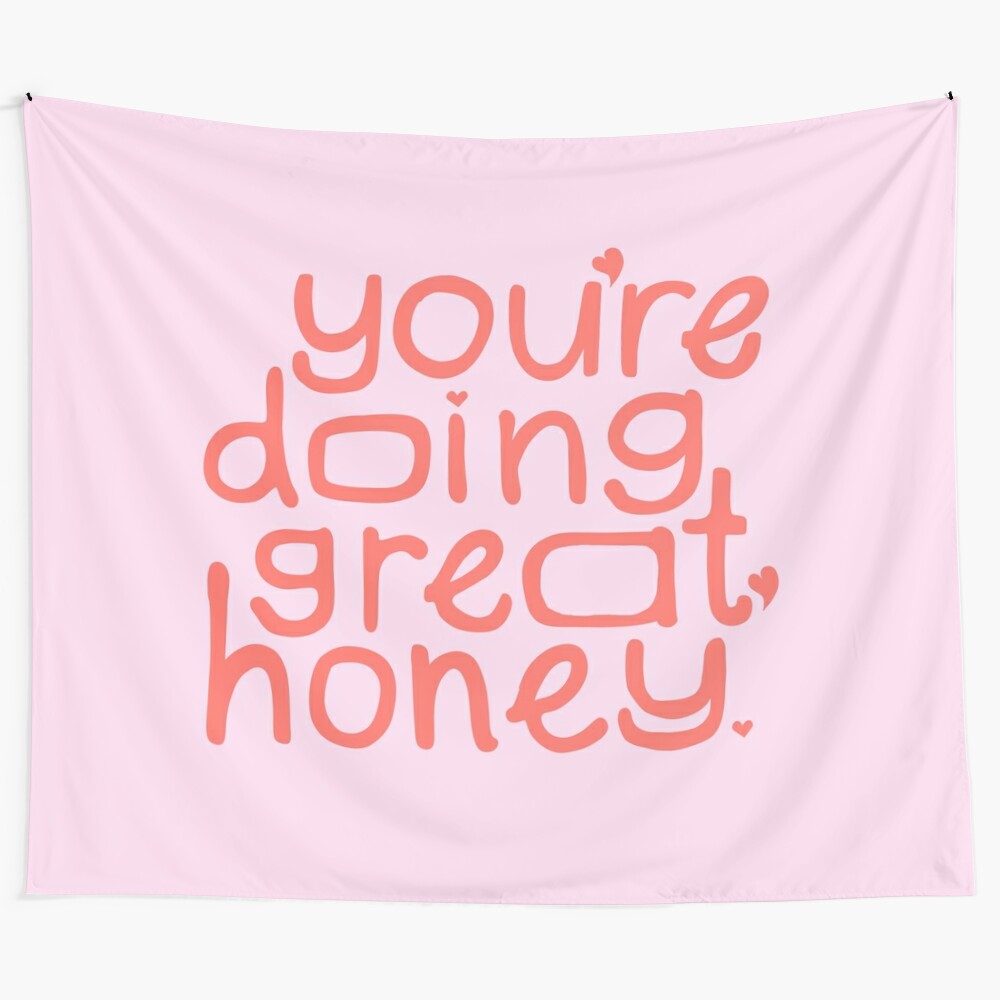 Minimalist tapestry with a hand-lettered motivational quote in pastel pink and coral